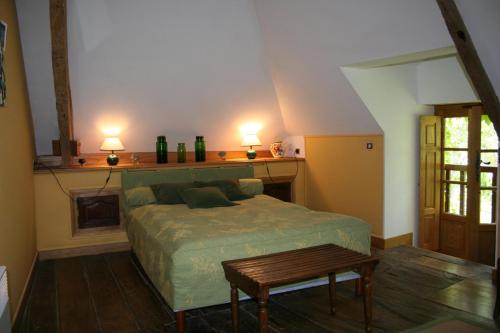 Postel nebo postele na pokoji v ubytování Manoir de Pommery