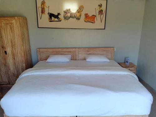 Кровать или кровати в номере Guesthouse Gelombang