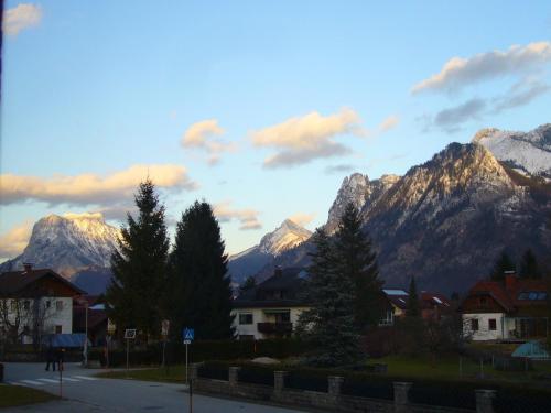 a view of a mountain range with houses and trees at Rosenhof in Ebensee