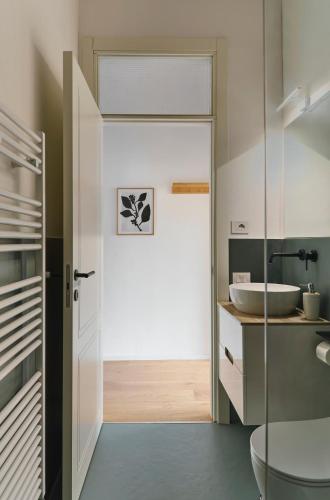 a bathroom with a toilet and a sink at La Sismonda in Rimini