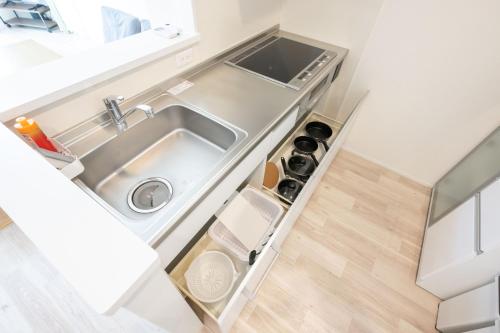 Η κουζίνα ή μικρή κουζίνα στο 駅徒歩4分 2LDK apartment