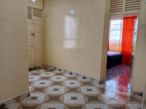 a hallway with a room with a tiled floor at Blessing homes in Mombasa