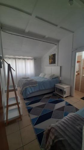 a bedroom with two beds and a ladder in it at Alhoa 2 in Gariepdam