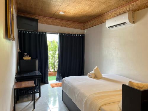 Postel nebo postele na pokoji v ubytování Namthip Homebeach