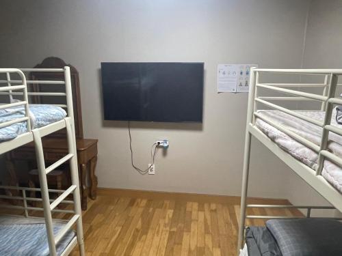 Ένα ή περισσότερα κρεβάτια σε δωμάτιο στο Lyndon Guesthouse