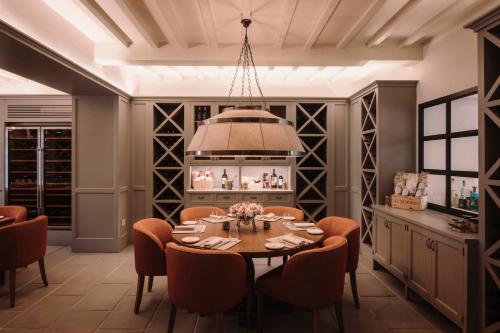 a dining room with a table and chairs at Viesca Toscana Suites & Villas in Reggello