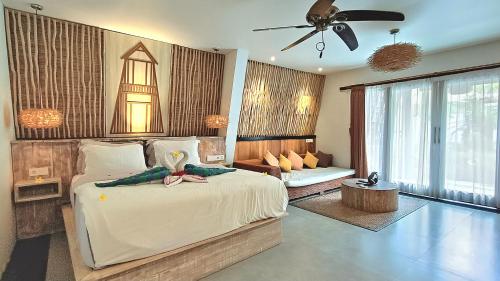 Postel nebo postele na pokoji v ubytování Kies Villas Lombok