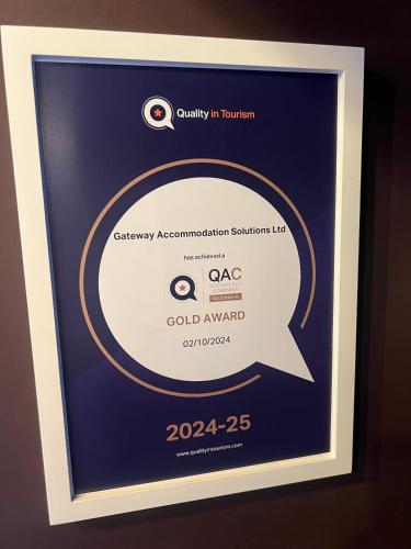 a framed picture of the gold award for excellence in tourism at Eton House - Self Check-In, Ensuite Rooms & Self-Catering Studios in Yeovil