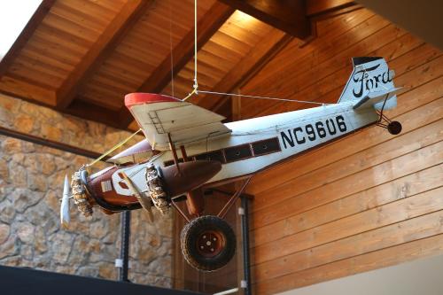 a model airplane hanging from the ceiling of a room at Anthidon Nature Estate & Farm in Chalkida