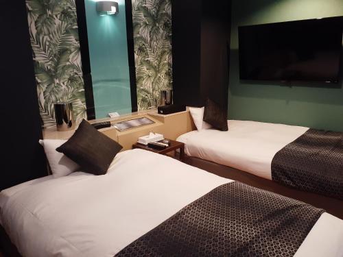Postel nebo postele na pokoji v ubytování Hotel Moana Otsuka (Adult Only)