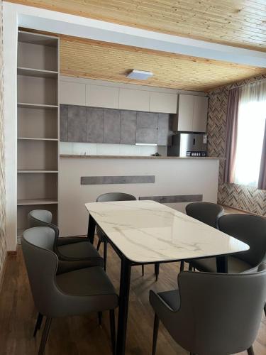 a dining room with a table and chairs at Mestiakhedi in Mestia