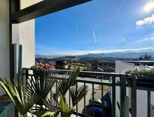 a balcony with a view of the mountains at Moderný apartmán s terasou in Prievidza