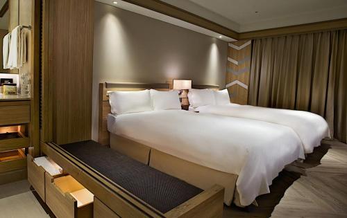 Postel nebo postele na pokoji v ubytování Hotel Royal Chihpin