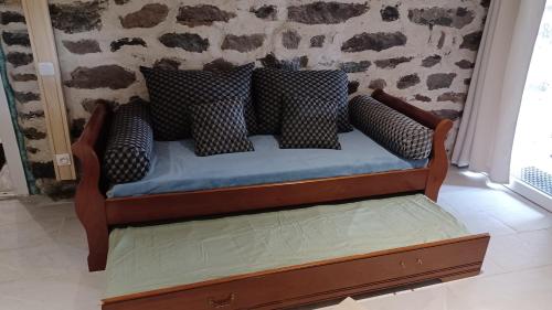Ένα ή περισσότερα κρεβάτια σε δωμάτιο στο Gite Le Buisson - Spa and sauna