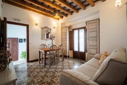 a living room with a couch and a table at La Sultana de Vejer in Vejer de la Frontera