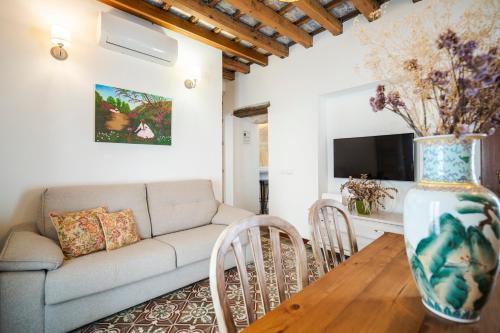 a living room with a couch and a table at La Sultana de Vejer in Vejer de la Frontera