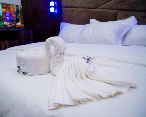 a swan made out of towels on a bed at Number Ten by Scarborough - Luxury Serviced Apartments, Asaba in Asaba