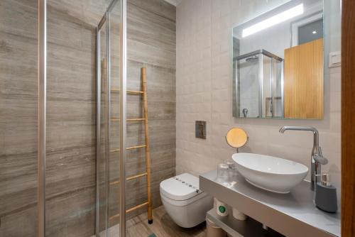 a bathroom with a toilet and a sink at AL-Odeceixe Verde in Odeceixe