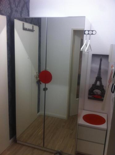 a room with a glass door and a room with the eiffel tower at Mini-Ferien-Suite Hildesheim in Hildesheim