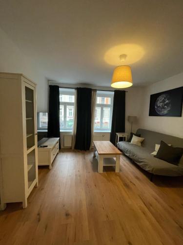 a living room with a couch and a table at Apartment in Reudnitz in Leipzig