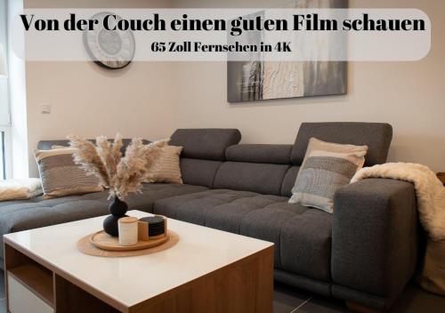 a living room with a couch and a coffee table at Ferienwohnungen Im Kimmelreich in Irsch