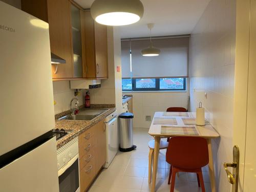 a kitchen with a table and a counter top at BestHomeStay- Lisbon- Garden, Pool & Garage in Lisbon