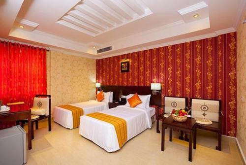 Cama ou camas em um quarto em Sreelakshmi Residency