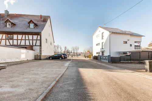a car parked on a road next to a house at Gemütliches Appartament in Aldingen