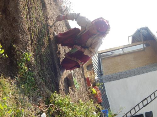 a person is climbing a wall with a hammer at Paarli Dhara,Bir in Bīr