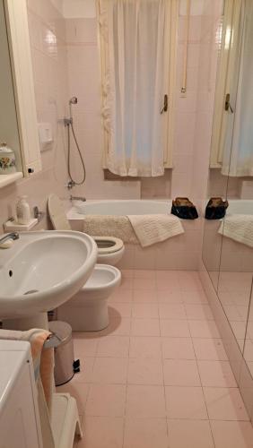 a bathroom with a sink and a toilet and a tub at Angolo Verde in Santa Margherita Ligure