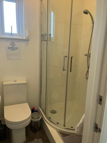 a bathroom with a shower and a toilet at Cliftonville House in Whitstable