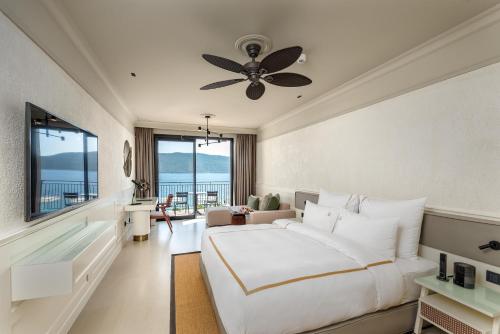 a bedroom with a large white bed and a large window at Casa Nonna Bodrum - Adult Only in Bodrum City