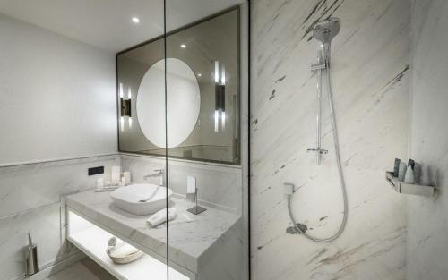 a bathroom with a shower and a sink and a mirror at Casa Nonna Bodrum - Adult Only in Bodrum City