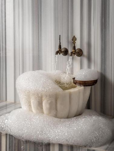 a bathroom sink covered in powdered sugar with a faucet at Casa Nonna Bodrum - Adult Only in Bodrum City