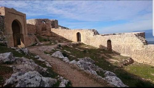 a building on top of a hill with rocks at Hotel Golden Star in Taounate