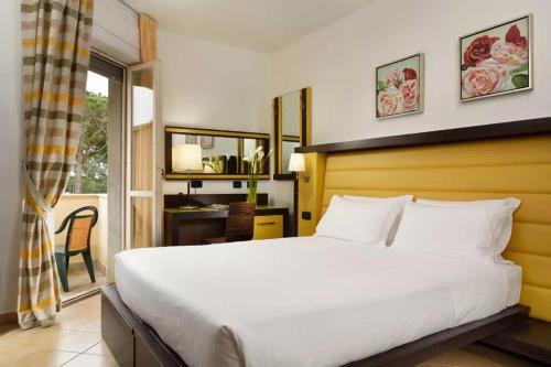 Ένα ή περισσότερα κρεβάτια σε δωμάτιο στο HOTIDAY Room Collection - Marinetta