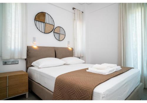 Postel nebo postele na pokoji v ubytování Naiada - Beachfront Luxury Villa