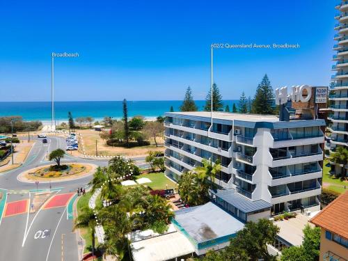 an aerial view of a building near the ocean at Blue Palms By The Beach in Gold Coast