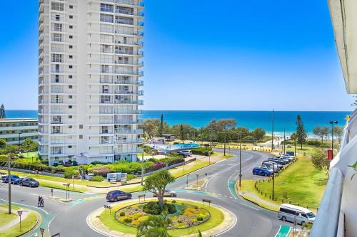 a view of a street in front of a tall building at Blue Palms By The Beach in Gold Coast