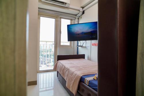 Postel nebo postele na pokoji v ubytování CitiBay View Staycation
