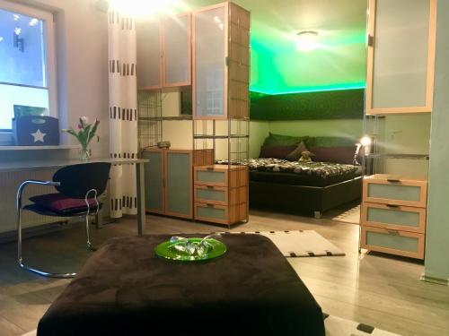 a room with a bedroom with a bed and a table at Apartment Schwabthal by Landhaus Staffelstein in Bad Staffelstein