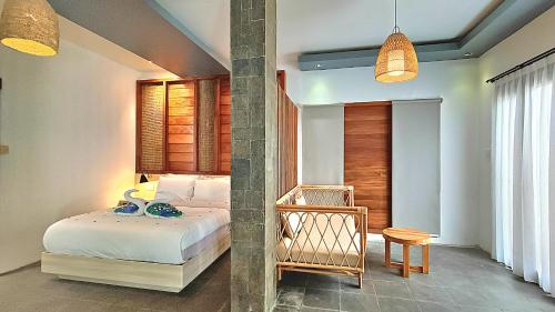 Postel nebo postele na pokoji v ubytování Kies Villas Lombok