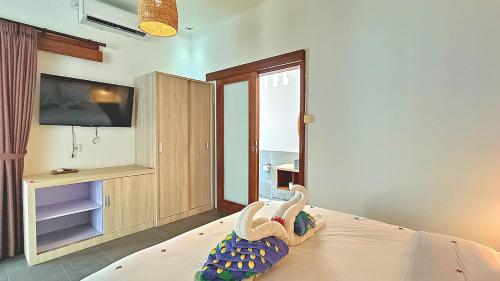 TV a/nebo společenská místnost v ubytování Kies Villas Lombok
