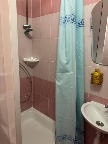 a bathroom with a shower and a sink at Готель "Український Дворик" in Lviv