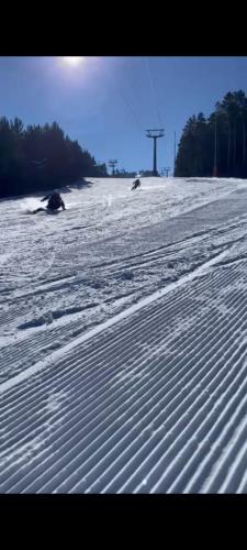 a snow covered beach with tracks in the snow at Sarıkamış CK Hotel in Seyhan