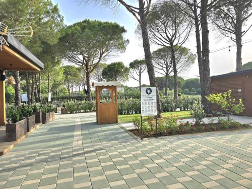 a park with a sign in the middle of a sidewalk at Sunny Beach Penthouse - 216 in Durrës
