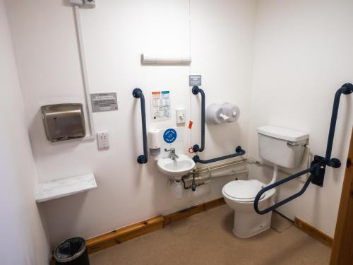 a bathroom with a toilet and a sink at YHA London Lee Valley in Cheshunt