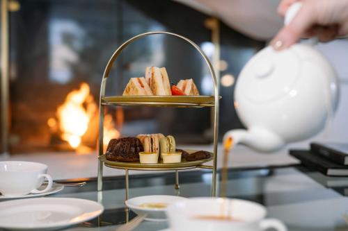 a serving tray with pastries on a table at A-ROSA Hotel Thurnher's Alpenhof in Zürs am Arlberg