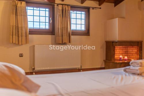 a bedroom with a bed and a fireplace and windows at Luxury appartment, only 7 minutes from Thessaloniki airport and 15 minutes from city center ,for 8-23 people also for gatherings and parties in Néon Rýsion