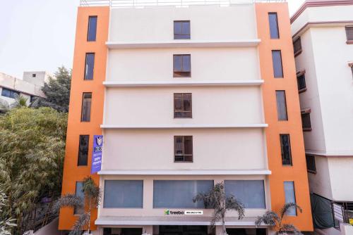 an orange and white building at Treebo Iris Executive, Hinjewadi in Pune
